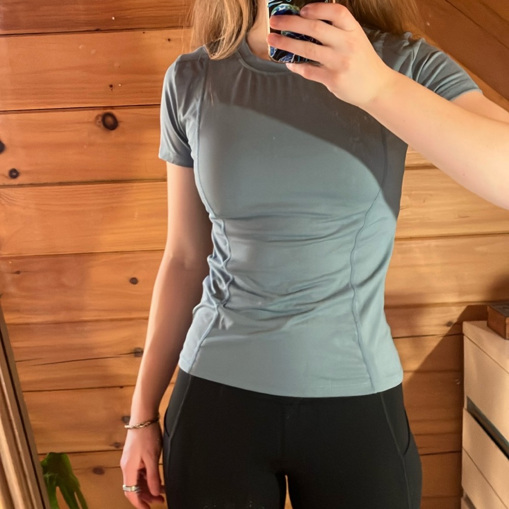 Women small blue and black fitted/slim workout shirt